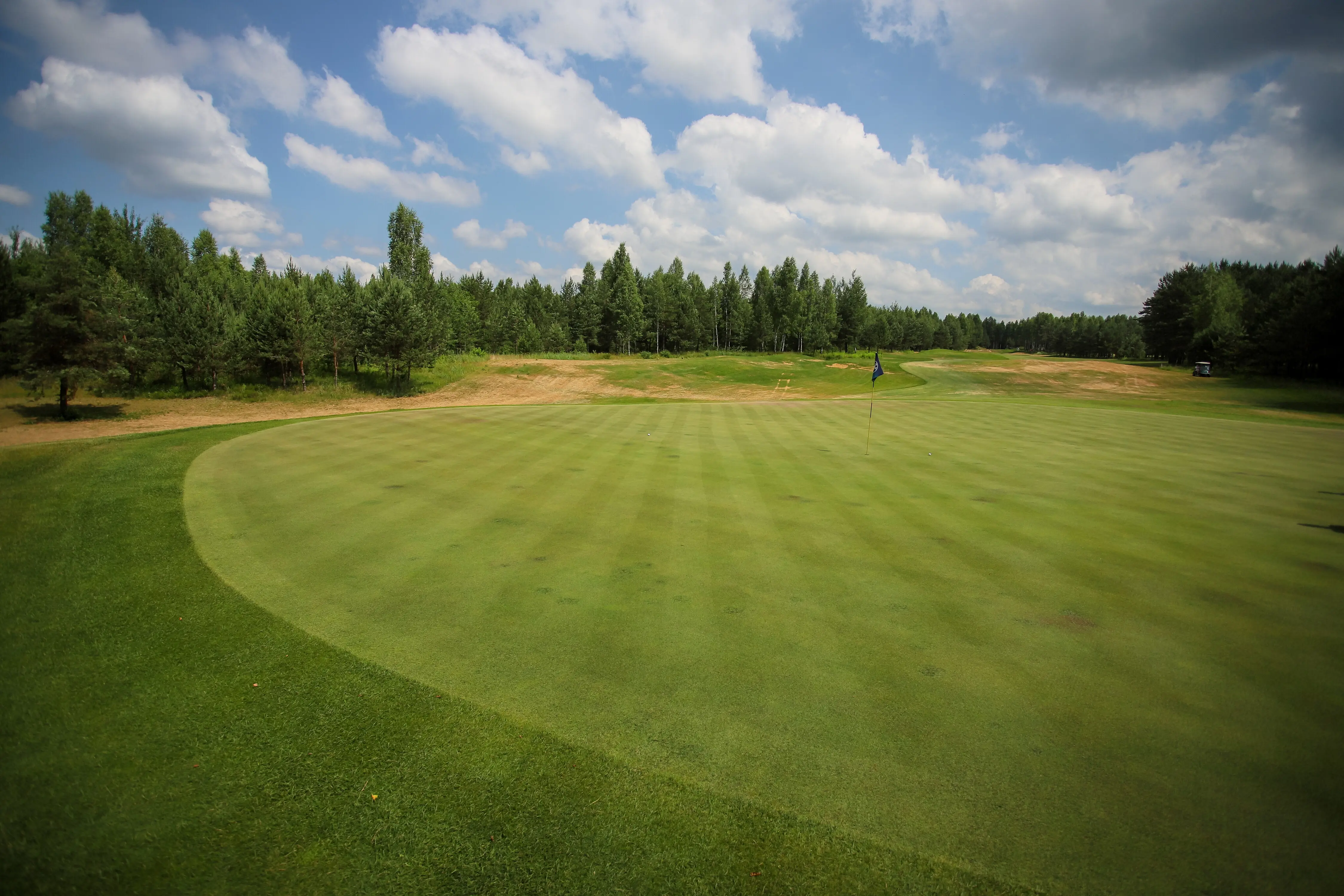 Picturesque vista of a golf course set against the sky